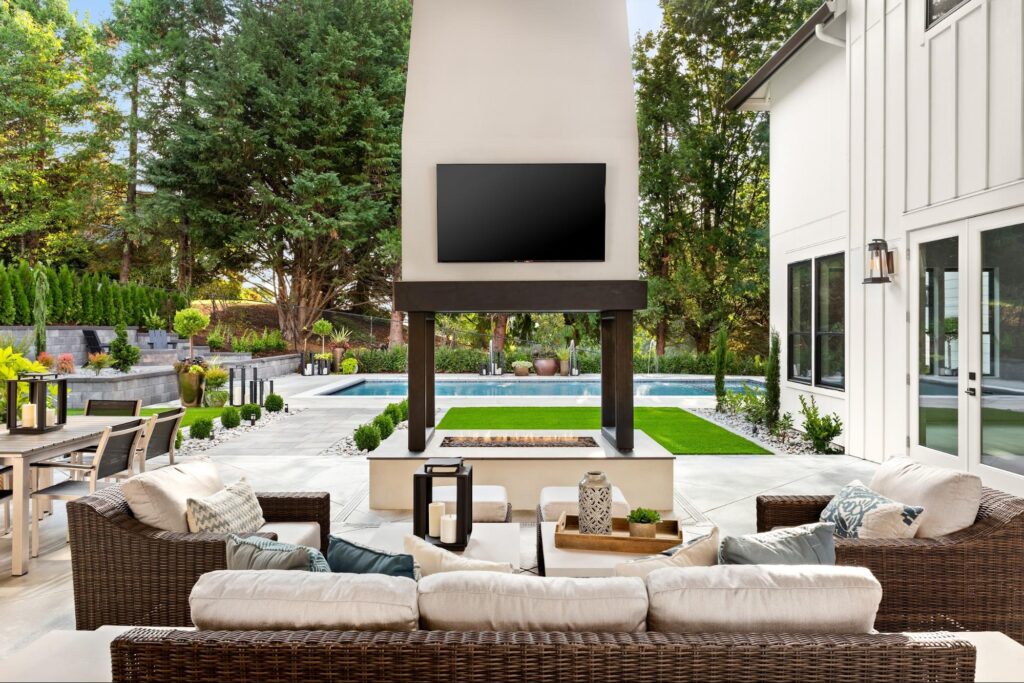 Covered patio with furniture and a backyard entertainment system