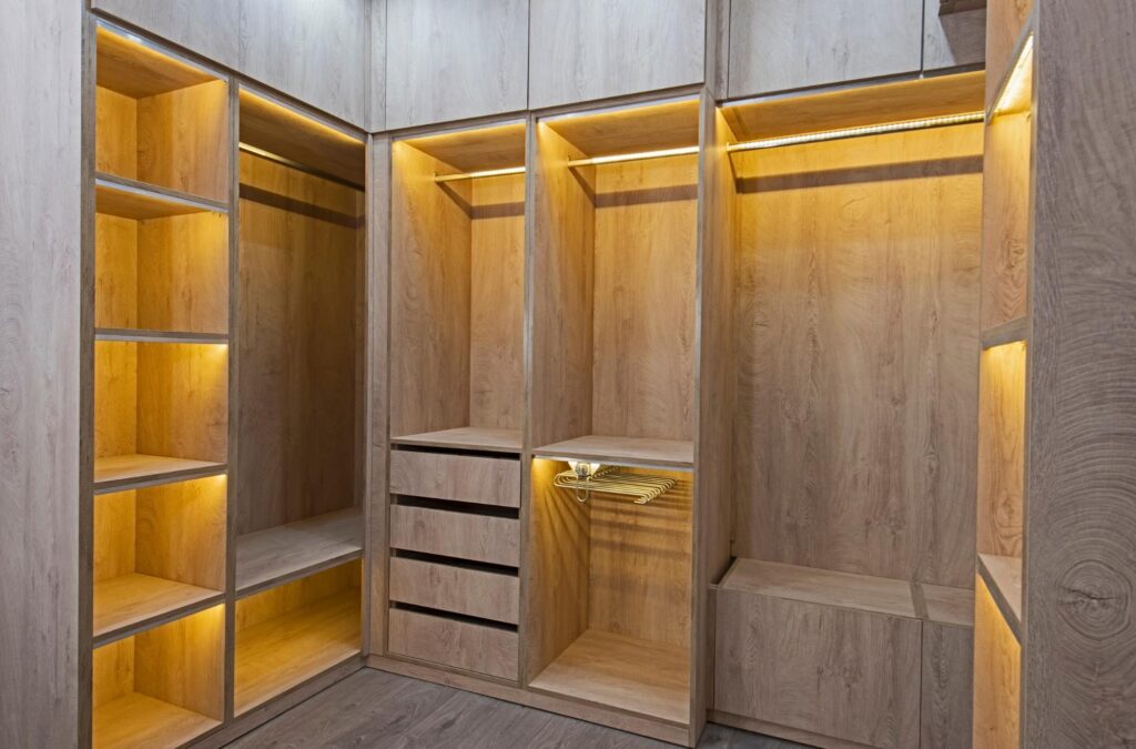 Luxury walk-in closet with undershelf LED lighting