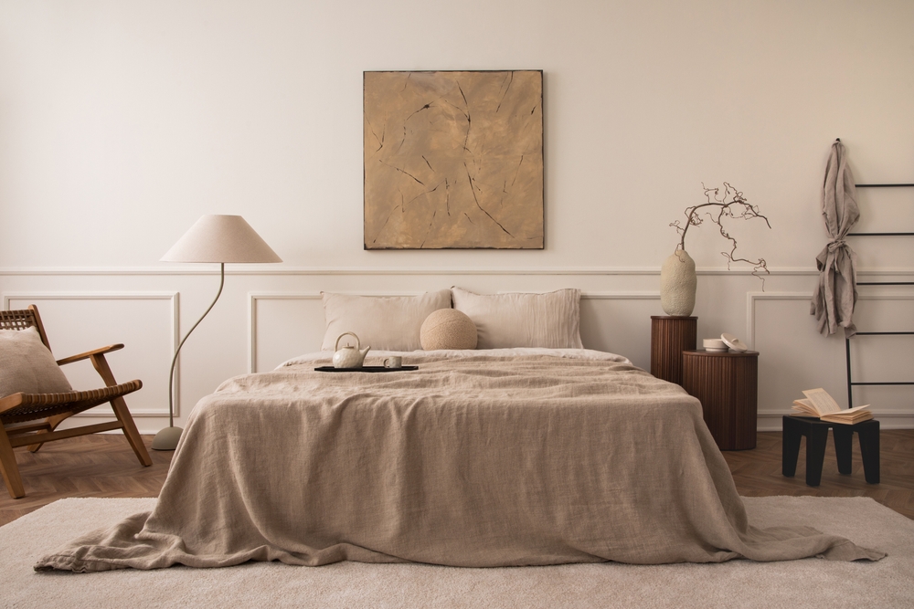Japandi style bedroom featuring linen and wood textures, handmade accents, and natural elements