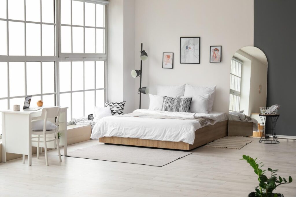 Bedroom with a mirror facing away from the bed