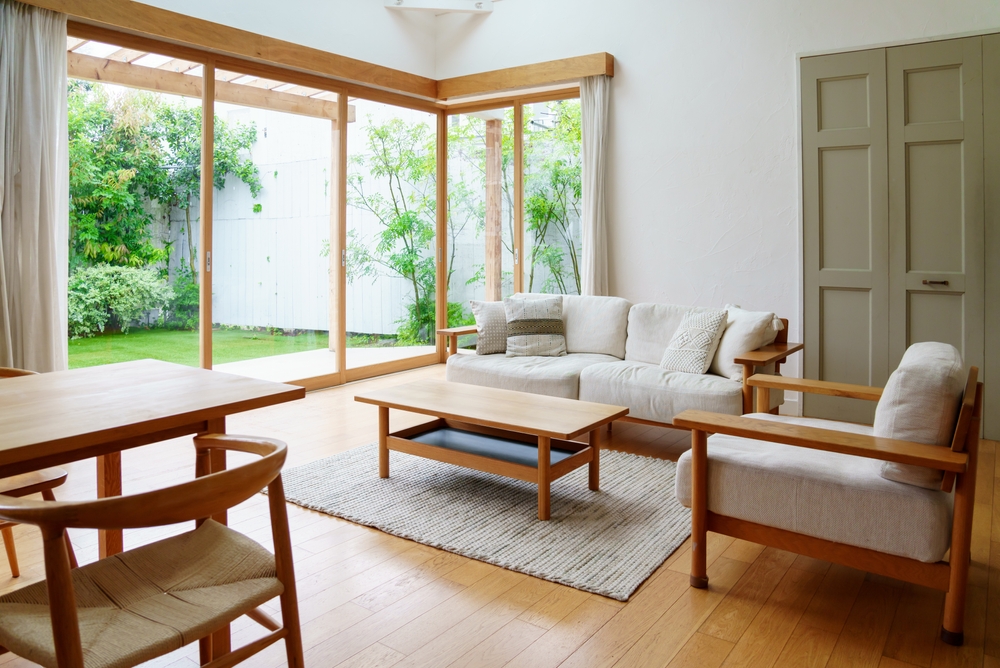 Living room exhibiting feng shui design principles, including natural light and no clutter